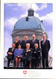 The photo with 8 persons. 148x210mm��It is Chairman Flavio Cotti in front row third person from left.
